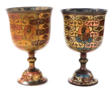 Two large similar Indian enamelled brass goblets, decorated with portrait vignettes and peacocks, within polychrome reserves 