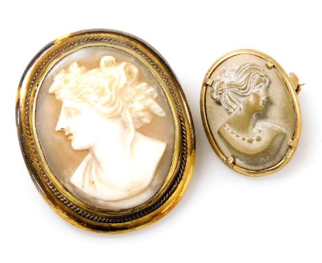 A late 19thC Italian lava cameo brooch, bust portrait of a lady, in a yellow metal mount, indistinctly stamped, and a shell c