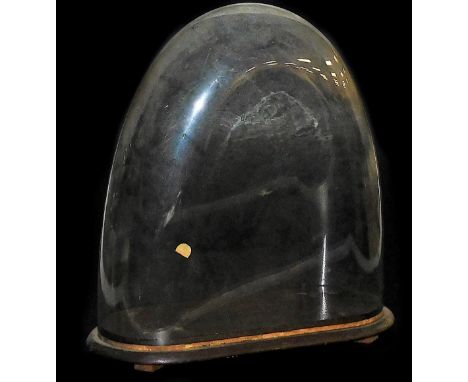 A glass dome, of arched form, with mahogany base, possibly for a clock, 49cm high, 44cm wide. 