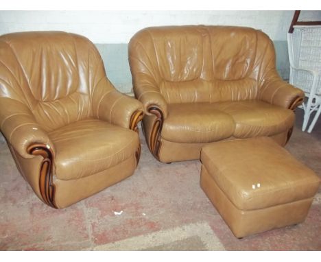 A THREE PIECE LEATHER ITALIAN STYLE SUITE COMPRISING A TWO SEATER SOFA, CHAIR AND STOOL