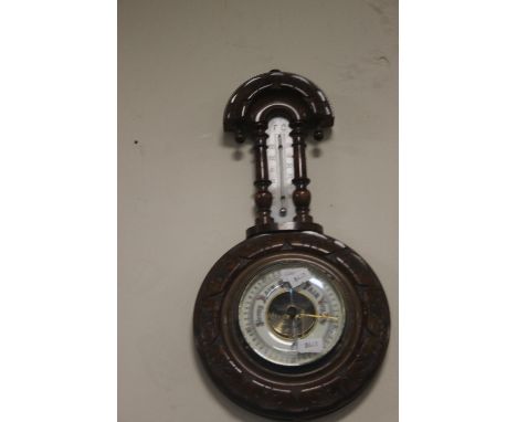 A SMALL HANGING BAROMETER