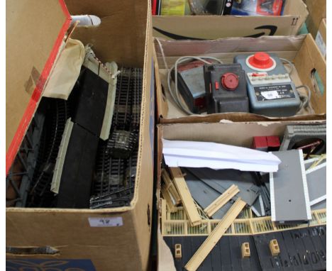 A quantity of assorted 00 scale tracks, buildings and controllers including a turn table in original box