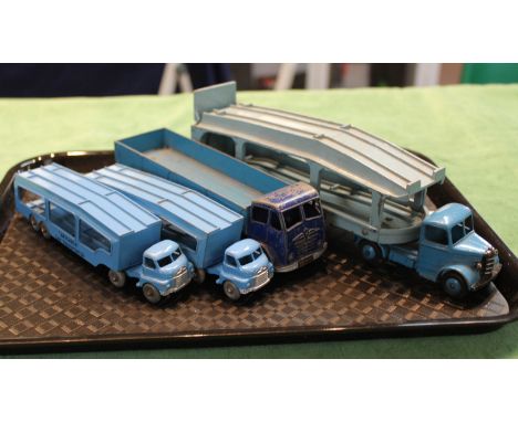 Four toy lorries including a pair of Matchbox car transporters plus a Dinky Foden