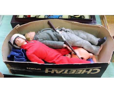 A box containing two Action Man figures, assorted clothes, body parts, accessories etc
