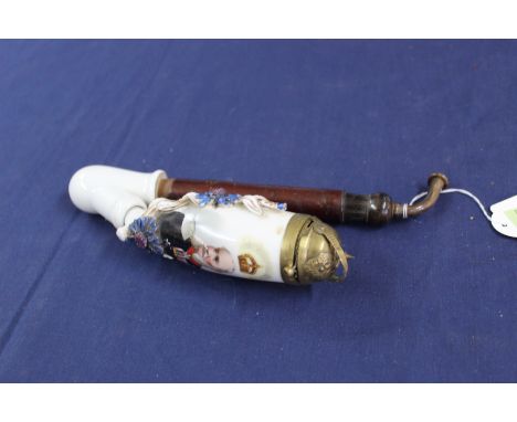 A late Victorian ceramic pipe bearing image of Kaiser Wilhelm I of German with pipe bowl cover modelled as miniature Pickelha