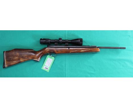 A 'Webley Tracker' .22 cal air rifle with Rushmaster 3-9x40 scope, S/No.43528 (N.B. finish on woodwork as found), as a post 1