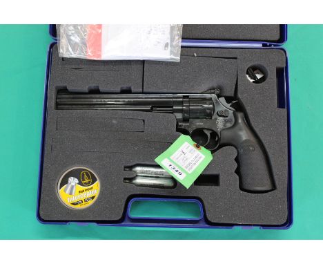 A Smith &amp; Wesson model 586 .177 cal CO2 air pistol, this being the 8" barrel model, complete with fitted case and a box o