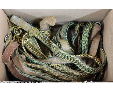 A box of various chin chain helmet straps