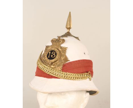 A post WWII colonial service helmet with Canadian militia 13th Reg't plate