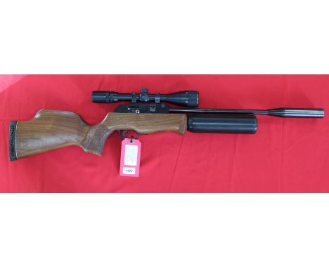 A Theoben 'Radid 7' air rifle with Nikko Stirling 4-12x40 scope, spare magazine and refill air cylinder, (N.B. This is a Sect