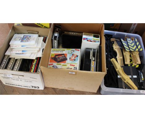 A large quantity of boxed and unboxed Scalextric track, scenery, controllers etc (three boxes)