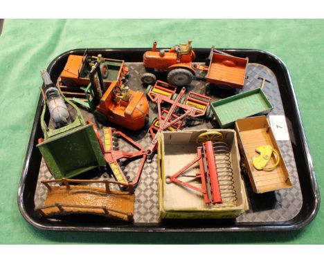 A quantity of assorted farm implements and vehicles including a boxed Dinky hay rake and a tractor and trailer
