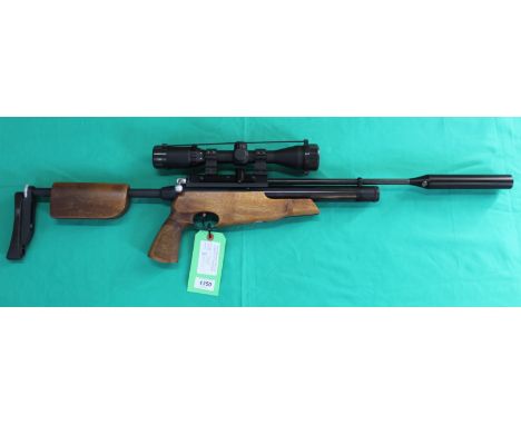 An Air Arms S410 T.D.R. .22 P.C.P. air rifle complete with scope, three magazines, filler pipe and carry case, overall in out