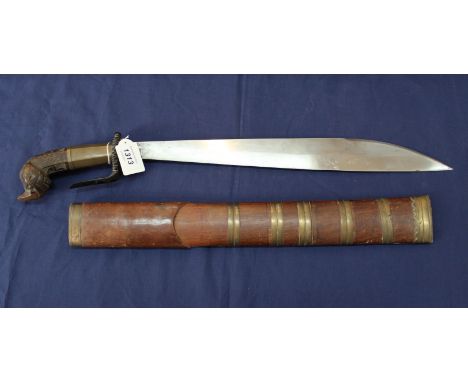 A fine quality 'Parang' with carved wooden hilt and brass bound wooden scabbard