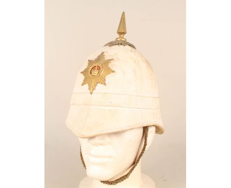 A Canadian WWI era Colonial service helmet with 'Royal Military College Canada' plate