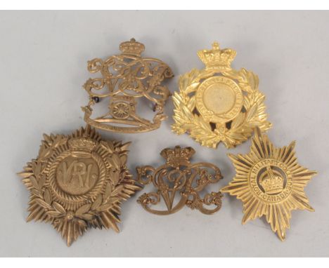 Five various British helmet plates