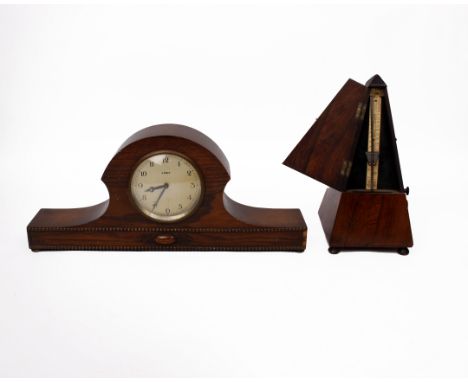 A mahogany cased metronome together with an oak mantle clock. 