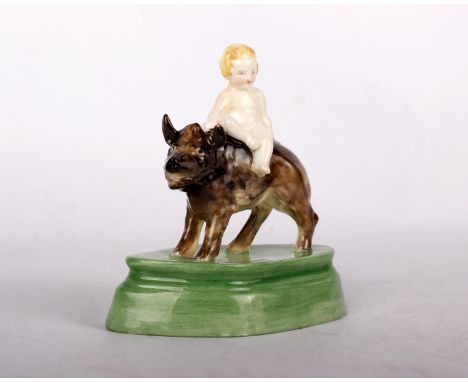 A rare Royal Worcester miniature figure of the Boy on Boar, modelled by Phoebe Stabler, decorated in coloured enamels, on ova
