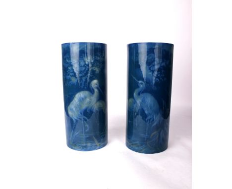 A Pair of Royal Worcester Sabrina Ware cylinder vases decorated with storks wading amidst grasses and foliage,  by Wm Powell,
