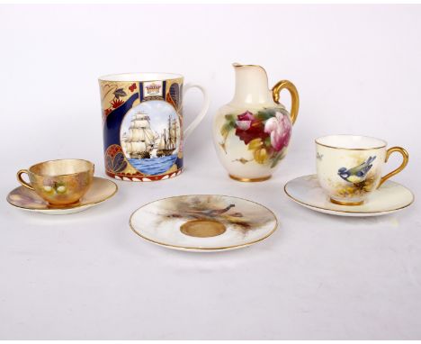 A mid c20th Royal Worcester miniature cabinet cup and saucer hand painted with blue tits by Ernest Barker together with one o