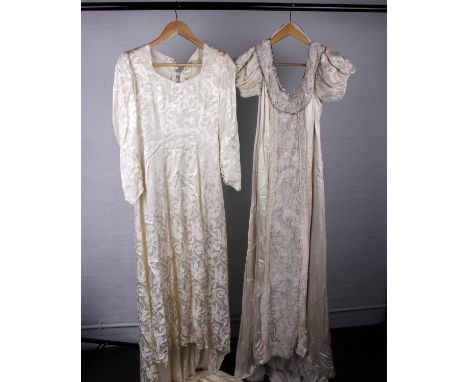 Two vintage cream wedding dresses both with trains. One dress with long sleeves and button back the other with short puff sle