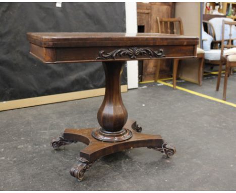 A Victorian mahogany flip top card table with circular inset top, single pedestal support to scroll feet. 90cm(w)