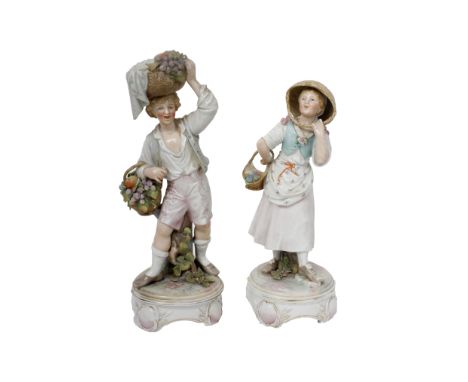 A pair of 19th century Meissen porcelain figures of a gentleman carrying fruit and wearing a blue jacket and pink trousers st