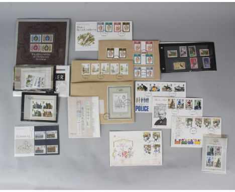 A collection of UK stamps and first day covers contained within a leather suitcase. 