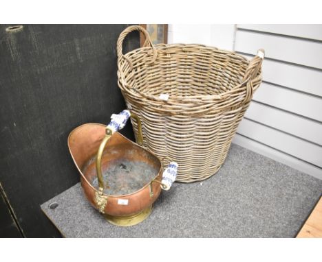 A wicker log basket and a copper fire helmet with ceramic handles.