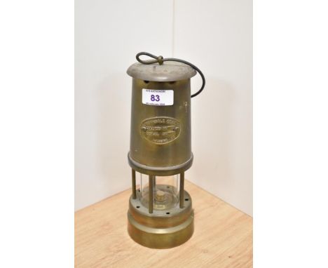 A vintage brass Ferndale coal and mining Co miners lamp.