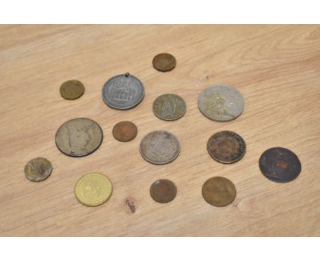 A selection of collectable coins and a commemorative Queen Victoria 60th anniversary medal.