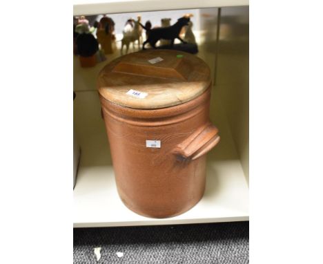 A vintage stoneware lidded crock pot