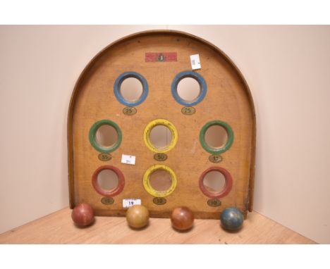 An early 20th Century Chad Valley 'Skee' Ball game, with four balls, measuring 36cm x 36cm