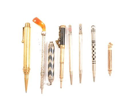 Three gold-plated propelling pencils, ranging from 5cm to 10cm; a pair of silver Bridge propelling pencils, Ari D Norman, Bir