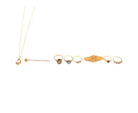 Small selection of gold items, a bar brooch marked 9ct, with base metal pun; five rings, one with an oval mixed cut smoky qua