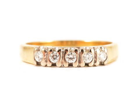 A diamond five stone half hoop ring, the brilliant cut stones vertically line set in a yellow and white metal mount ring size