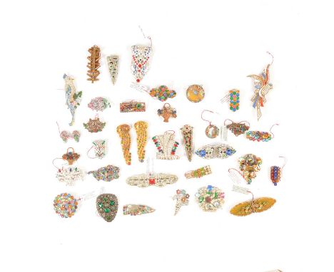 Thirty-four multi coloured paste set brooches and clips, circa 1930/1950, mostly American manufacture, a 60mm duette dress cl