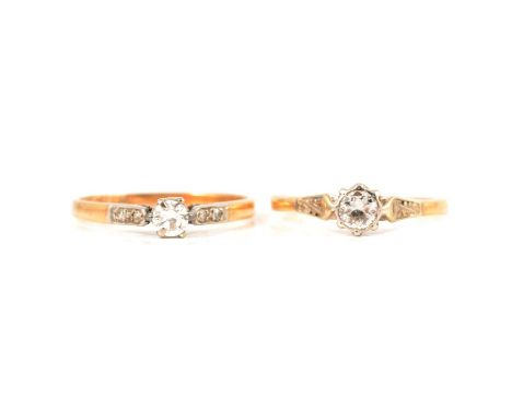 Two diamond solitaire rings, a diamond solitaire ring, the brilliant cut stone claw set in a yellow and white metal mount rin