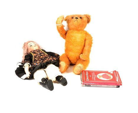 Three vintage teddy bears, modern bisque head doll, and a quanitiy of Doll and Teddy bear collecting books.Qty: one box