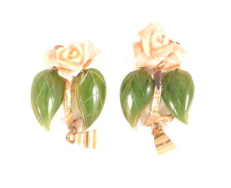 A pair of coral and jade pendants, each pendant having a carved coral rose and pair of carved green jade leaves, in yellow me