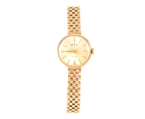 Rotary - a lady's 9 carat yellow gold bracelet watch, circular champagne baton dial in a 20mm case fitted with a 9 carat yell