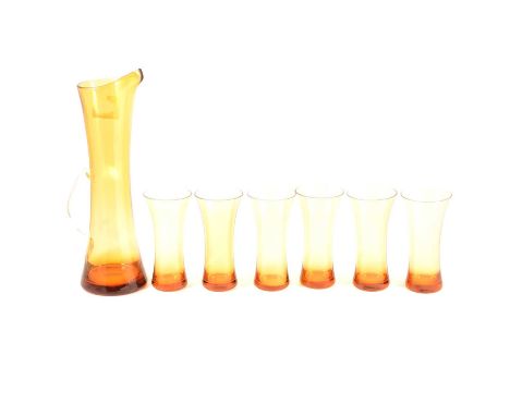 A Mid-Century vintage amber glass lemonade set, comprising of six beaker cups of tapering hourglass form with matching tall s