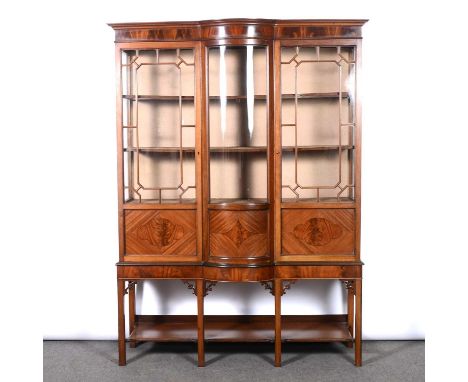 Edwardian mahogany bowfront china cabinet, plain frieze, astragal glazed doors, above an open shelf base, width 138cm, depth 