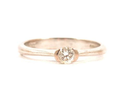 A diamond solitaire ring, the brilliant cut stone set in an 18 carat all white gold CC setting ring size K, Carst weight of d