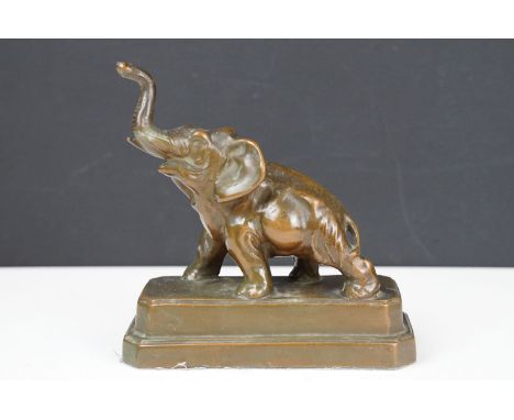 Bronze model of an Elephant on a stepped plinth base, stamped Nuari ?, N.Y.C., Made in USA, approx 18cm high 