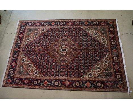 Vintage blue ground Persian Tabriz carpet with traditional medallion design&nbsp;and multi-coloured field, measures approxima