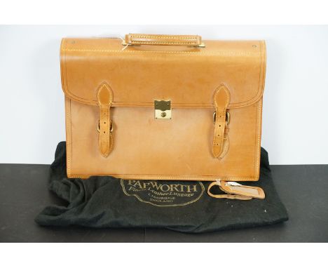 Papworth leather briefcase satchel having double buckles to front with metal lock to centre and handle to top. Label within a