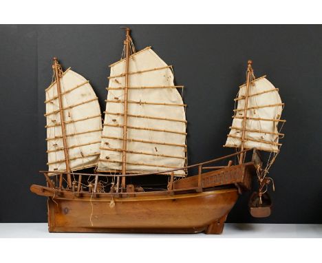 20th Century scratch built junk ship model having three sails, rope detailing, and life boat. Measures 56cm wide. 