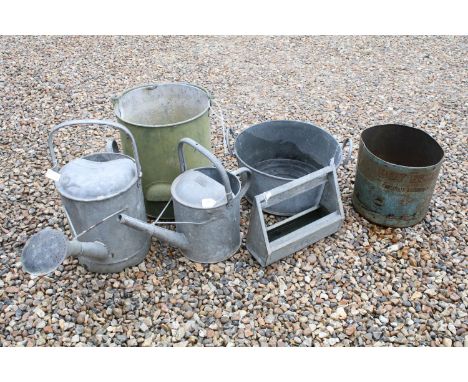 Two galvanised steel watering cans, a galvanised twin handled planter, a galvanised bucket with swing handle, a small galvani