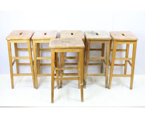 Set of six mid Century vintage wooden lab stools stamped Gomm Bros Ltd to underside of seats. 